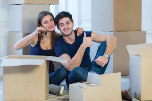 Removal team using safe lifting practices during a home move