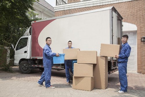 Local office relocation team working in Merton with crates and furniture
