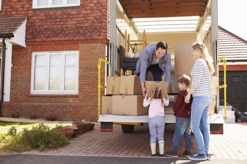 Packed moving boxes and furniture ready for transport