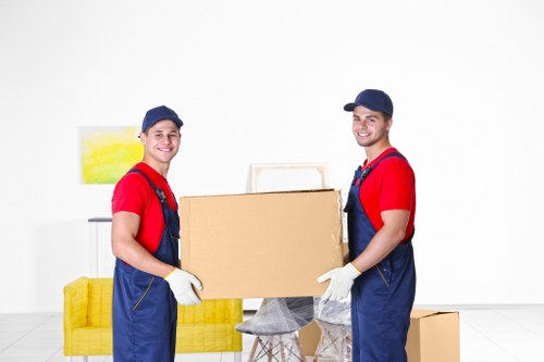 Professional movers preparing a safe relocation with protective procedures