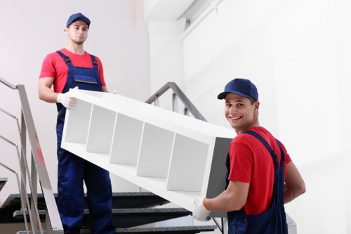 Professional moving van loading in a Merton neighbourhood