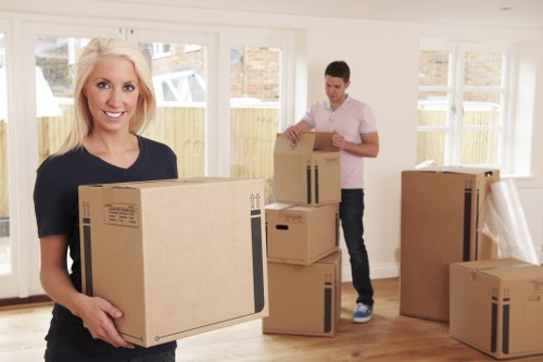 House removals team handling furniture in Merton