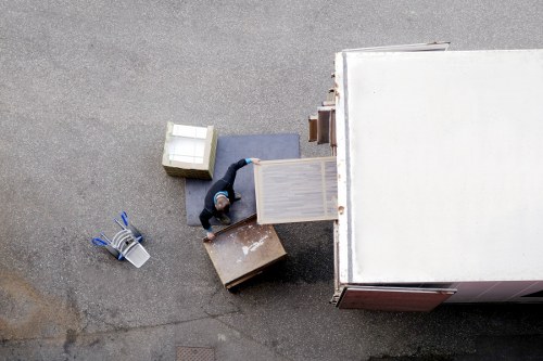 Furniture and packed boxes prepared for a house removal service in Merton