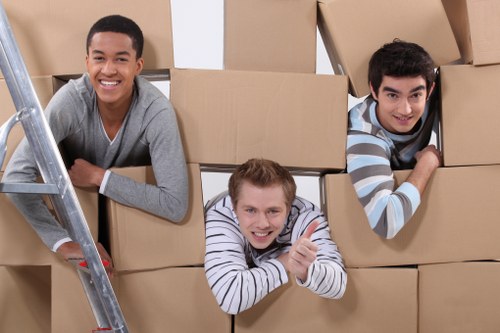 Helper unloading belongings at a Merton property