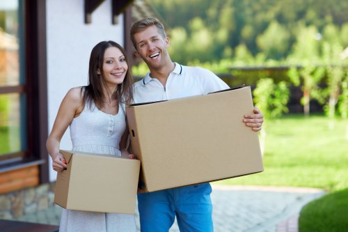 Professional movers handling a flat move in Merton with care