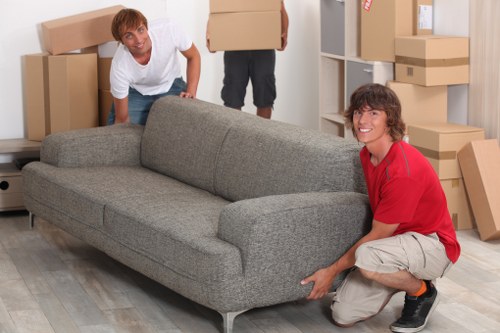 Careful packing process for a home move in Merton with labelled boxes